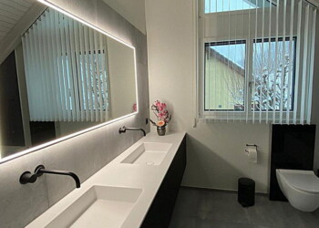 Waschtischunterbau schwarz matt mit Corianabdeckung in Rüfenacht Waschtischunterbau schwarz matt mit Corianabdeckung in Rüfenacht